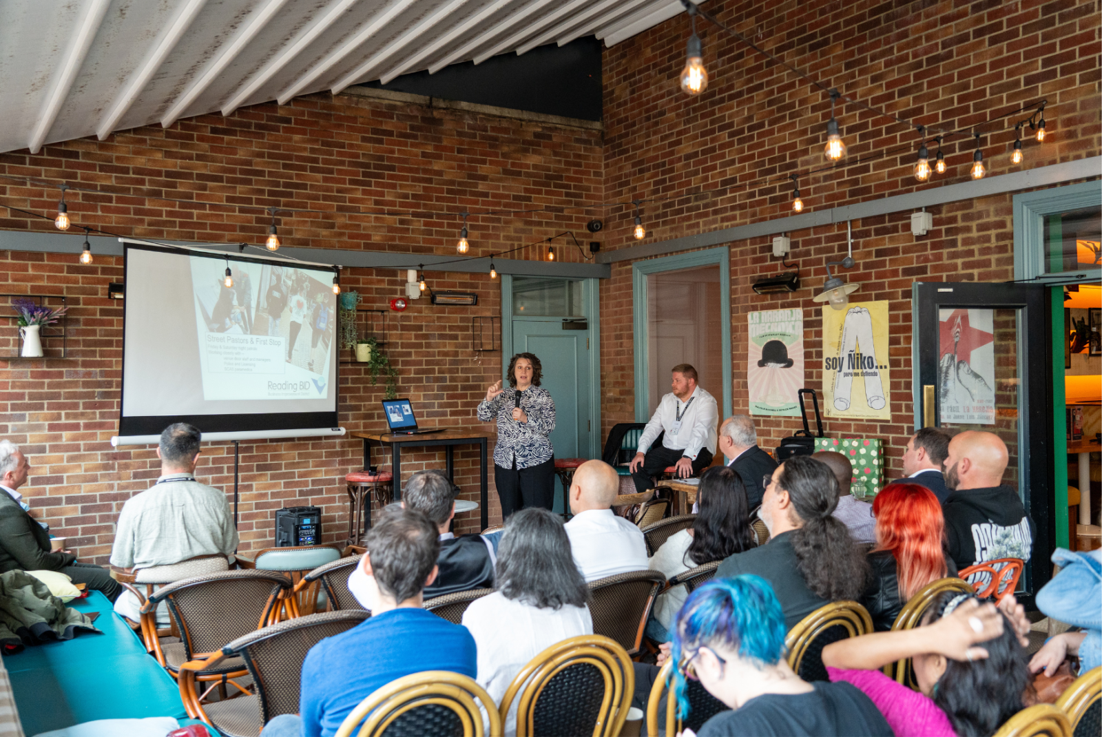 A woman presenting to a large group of people